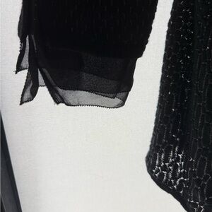 Elegant black/grey 2 tone novelty knit cardigan with sheer cuff detail